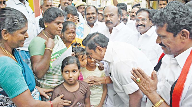 CM Edappadi K Palaniswami speaks to the children while campaigning for AIADMK candidate S Muniyandi contesting in Thiruparankundram by-election in a street at Iravathanallur in Madurai on Monday. (Image DC)