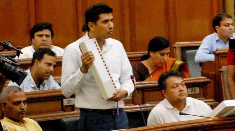 AAP MLA from Greater Kailash Saurabh Bharadwaj demonstrates how an EVM can be manipulated at the special Delhi Assembly session convened by Chief Minister Arvind Kejriwal. (Photo: PTI)