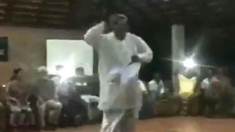 Dressed in a  white lungi and shirt with a towel thrown over his shoulder, much like Mr Siddaramaiah, he even wears spectacle like him.