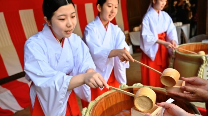 With sake and Shino rites, Japanese rang in a new imperial era
