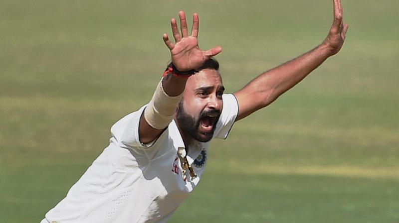 Indian bowler Amit Mishra appeals for the wicket of England batsman Zafar Ansari on the second day of the first Test match in Rajkot on Thursday (Photo: AP)