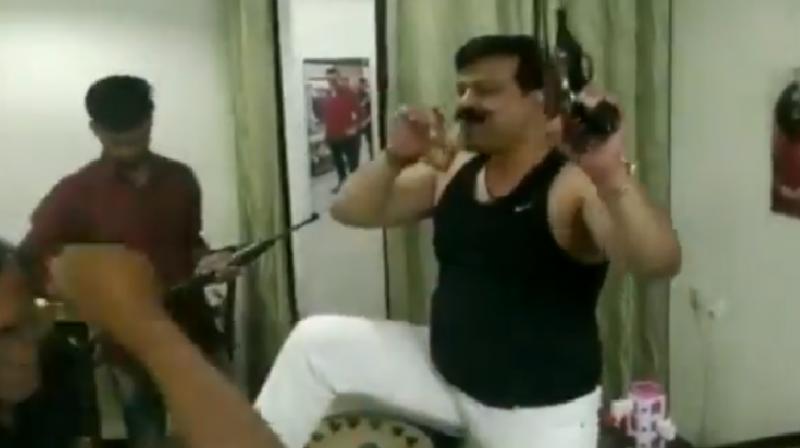 Watch: With 4 guns, a glass of alcohol, Uâ€™khand\s sacked BJP MLA dances to Hindi song