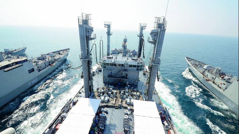 Navy personnel demonstrate on fuel replenishment from INS Shakti to other    warships of Indian Navy during an operational demonstration as part of             the Day-at-Sea for schoolchildren off the sea near Visakhapatnam on Friday. (Photo: DC)