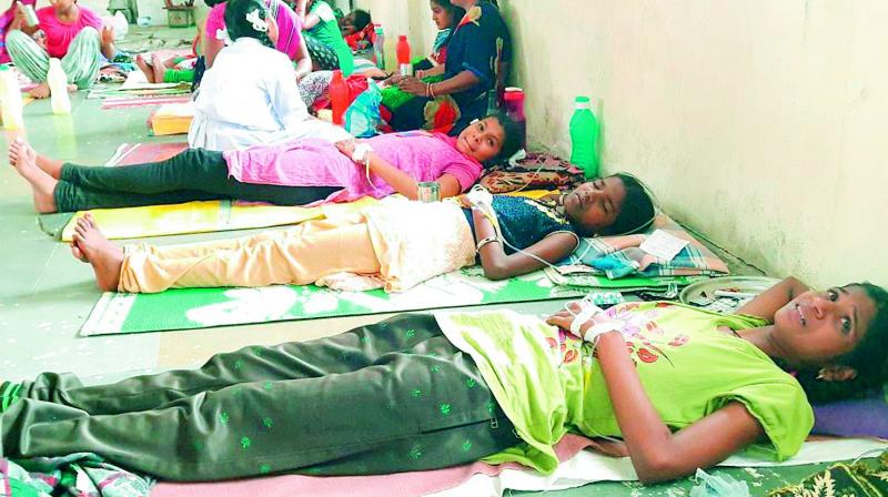 Students of the government-run residential hostel being treated for alleged food poisoning at a primary health care centre in Yadadri on Saturday. (Photo: DC)