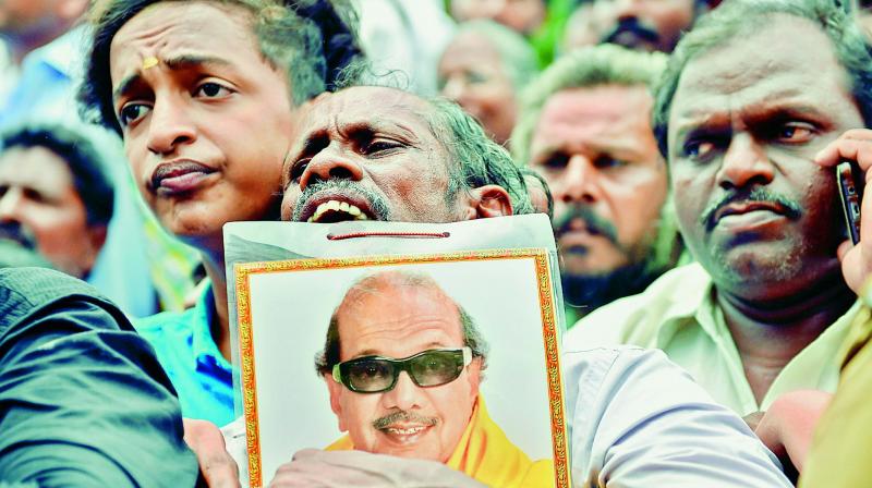 Supporters gather near the Kauvery Hospital where DMK president M. Karunanidhi was undergoing treatment.