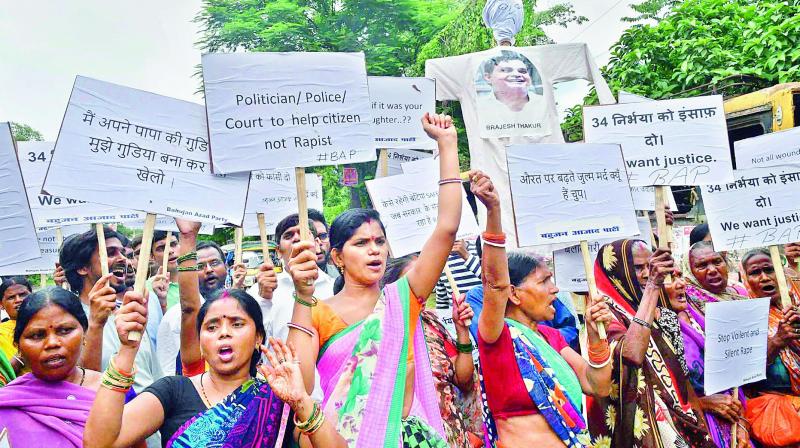 Bahujan Azad Party activists shout slogans during a protest against the Muzaffarpur shelter home rape case, in Patna on Tuesday. (Photo: PTI)