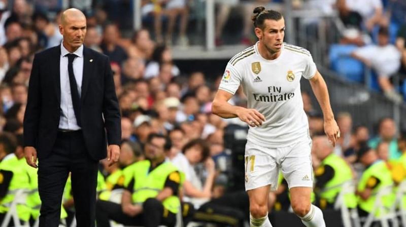 Gareth Bale scored twice to save Real Madrid from a damaging defeat away at Villarreal on Sunday before capping a dramatic 2-2 draw by being sent off in injury-time.  (Photo:AFP)