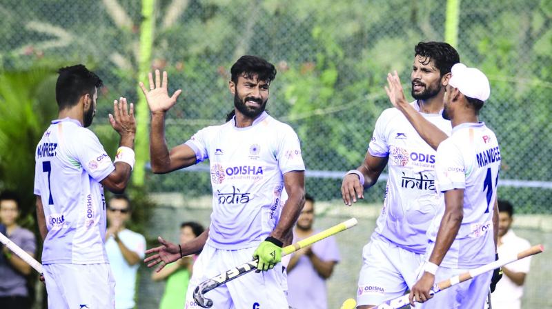 Indian players celebrate their 4-0 win over New Zealand in the last game of the three-match series in Bengaluru on Sunday.