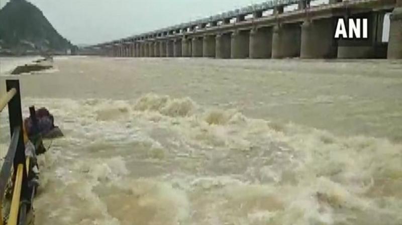 The barrage is receiving 4.5 lakh cusecs from the Pulichintala project and 70 gates of the barrage have been lifted for six feet height to release 4.5 lakh cusecs of water into the sea. (Photo: ANI)