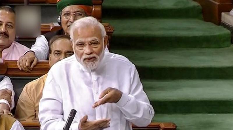 Prime Minister Narendra Modi speaks in the Lok Sabha on no-confidence motion during the Monsoon Session of Parliament, in New Delhi. (Photo: LSTV GRAB via PTI)