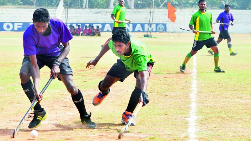 A hockey match in progress between Visakhapatnam and Krishna districts during the AP Senior InterDistrict Hockey tournament in Visakhapatnam on Saturday.