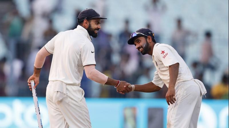 Virat Kohli was the non-playing captain on the day, carrying drinks during one of the breaks, while Ajinkya Rahane led the team in a Mahendra singh Dhoni-esque manner. (Photo: AP)
