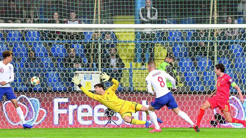 England midfielder Ross Barkley (second from right) scores a goal during the Euro 2020 qualifier against Montenegro at Podgorica City Stadium in Montenegro. England won 5-1.(Photo: AFP)