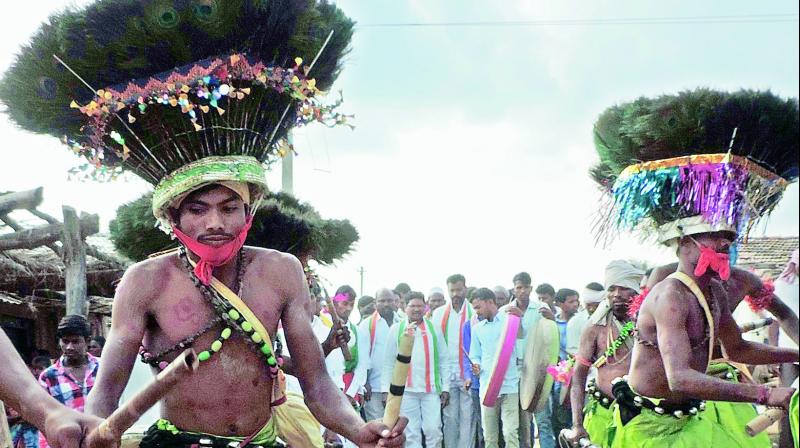 Adivasi youths dressed as  Gussadi  welcome Thudum Debba state president and former MLA Soyam Bapurao at Girjai village in Adilabad district on Sunday.  	 DC