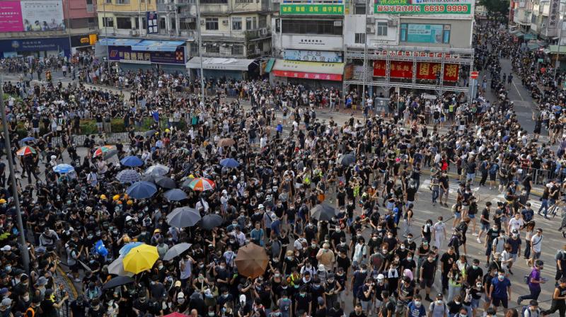 Clashes erupt as Hong Kong protest targets Chinese traders