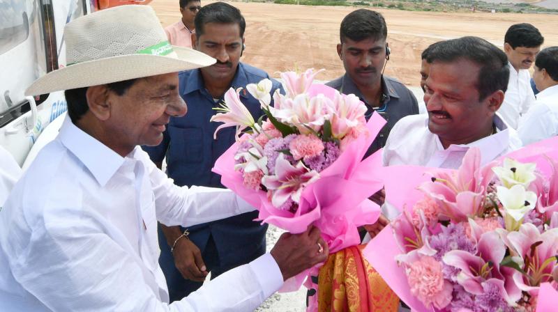 Chief Minister K. Chandrasekhar Rao is being received by party leaders near Karvena reservoir in Mahbubnagar on Thursday.  (DC)