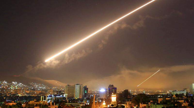Damascus skies erupt with service to air missile fire as the U.S. launches an attack on Syria targeting different parts of the Syrian capital Damascus, Syria, early Saturday, April 14, 2018. Syrias capital has been rocked by loud explosions that lit up the sky with heavy smoke as U.S. President Donald Trump announced airstrikes in retaliation for the countrys alleged use of chemical weapons. (Photo: AP)