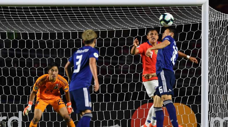 Alexis Sanchez found the net with a header in the 82nd, and Vargas closed the scoring about a minute later with a long lob shot over goalkeeper Keisuke Osako as he charged from his net. (Photo:AFP)