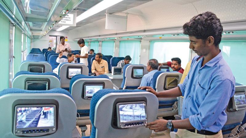 A railway official explains features of Anubuthi coach on Thursday. (Photo: DC)