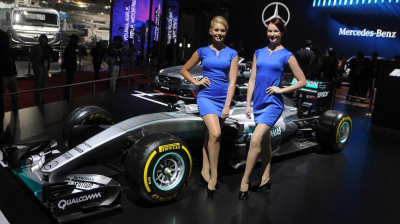 Models pose next to Mercedes Benz racing concept car. (Photo: DC)