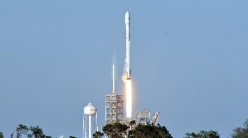 Space Xs recycled Falcon 9 rocket lifts off from Kennedy Space Center, cheered by experts as a \historic\ moment as companies scramble to lower space travel costs (Photo: AFP)