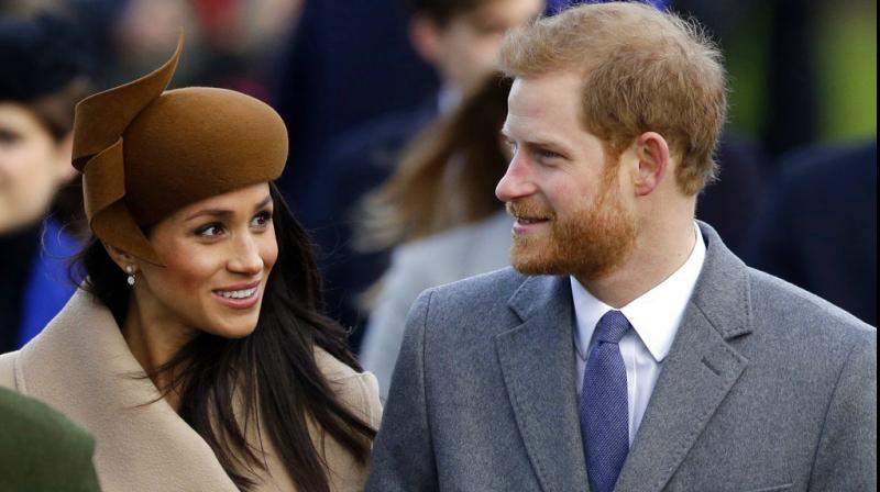Britains Prince Harry and his fiancee Meghan Markle arrive to attend the traditional Christmas Day service, at St. Mary Magdalene Church in Sandringham, England. (Photo: AP)