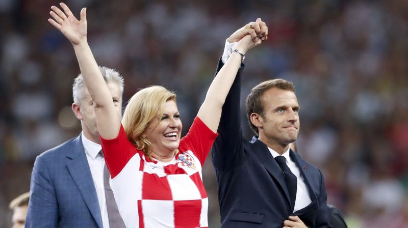 Croatian president Kolinda Grabar Kitarovic, clad in a red-and white Croatia soccer shirt, stood on the podium with Russian President Vladimir Putin and French President Emmanuel Macron when the medals were given to the players. (Photo: AP)