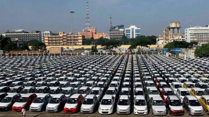 Automakers are planning to pass on the increased cess on mid-sized and large cars along with SUVs, after the GST Councils decision to raise it by up to 7 per cent. Photo: PTI