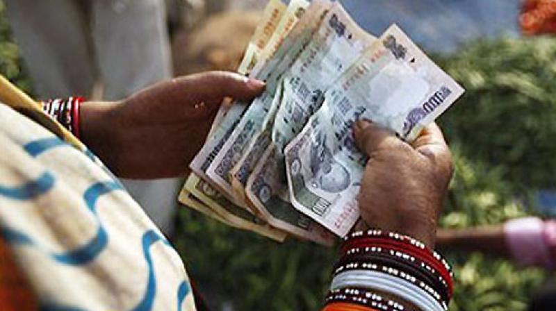 The rupee struggled at a fresh six-month low of 65.28. Photo: AP