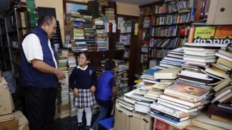 The Cambodian has an in-house library that has all the books he has collected over the years from richer areas in Southern Bagota. (Photo: AP)