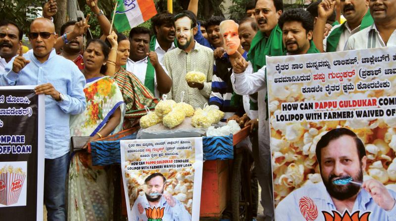 Members of the Congress IT Cell stage protest against the BJP-led NDA government at the Centre for not waiving off farmer loans, in Bengaluru in Bengaluru on Monday. (Photo: DC)