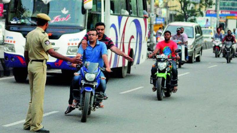 Road users in Vizag continue to jump red signals despite the presence of traffic police at all major junctions in the city. (Photo: DC)