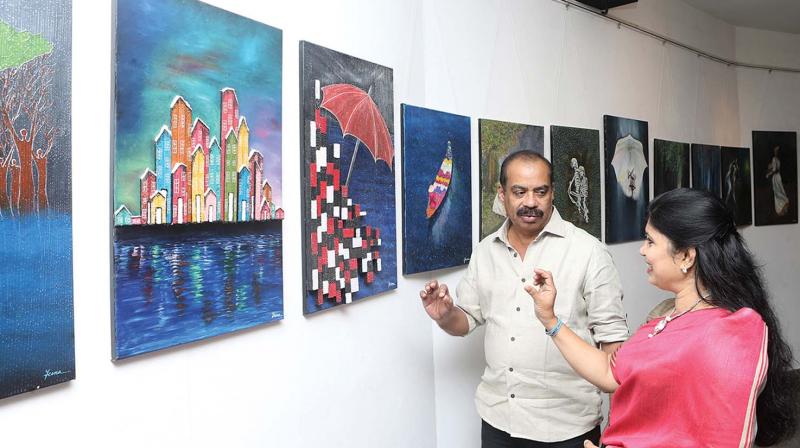 Jeena with director Sathyan Anthikad at the gallery