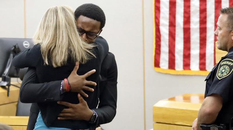\Can I hug her?\: Brother of slain black man forgives ex-cop in courtroom scene