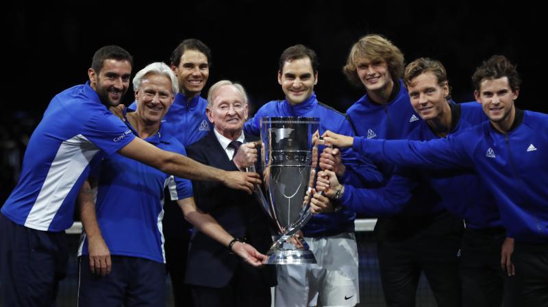 Team Europe together with tennis legend Australian Rod Laver hold a trophy after defeating team World in the Laver Cup tennis tournament in Prague. (Photo:AP)