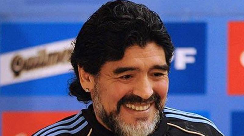 Maradona was to kick off a football conclave here on October 3, with a galaxy of Indian celebrities before locking horns with cricket icon Sourav Ganguly in a much-hyped Match for Unity in Barasat on October 5. (Photo:AFP)