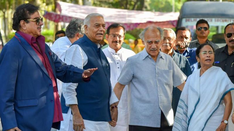 BJP leaders Shatrughan Sinha, Yashwant Sinha and Arun Shourie with West Bengal chief minister Mamata Banerjee in New Delhi on Wednesday. (Photo: PTI)