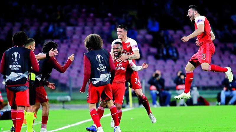 Arsenals Alexandre Lacazette (third from right) celebrates with his teammates after scoring against Napoli during the Europa League second leg quarterfinal match at San Paolo stadium in Naples, Italy, on Thursday. Arsenal won 1-0 to progress 3-0 on aggregate. (Photo: AP)