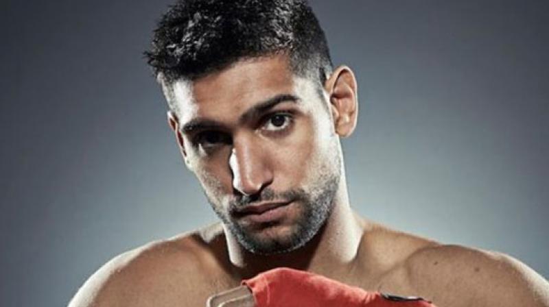 Boxer Amir Khan promises to avenge Pakistan\s loss to India