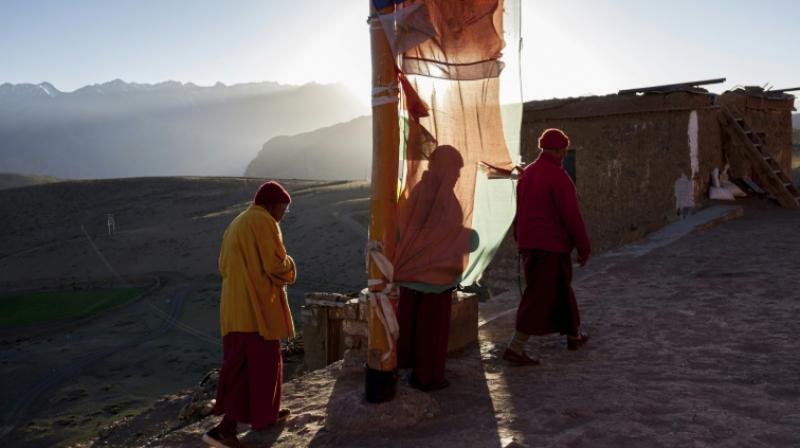 The monks and residents of the nearby village of Komik, said to be Asias highest, are already feverishly preparing for winter, stocking up on food and fuel, drying vegetables -- and praying. (Photo: AFP)