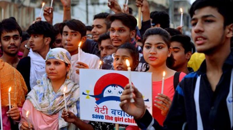 Students take part in a candle light march to protest against Kathua rape case, in Jabalpur on Thursday. (Photo: PTI)