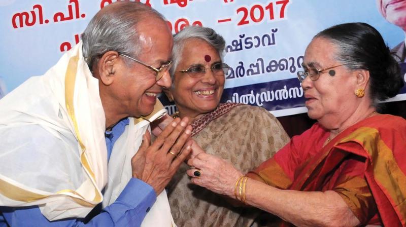 Sainaba Mammu, wife of freedom fighter and noted journalist late C.P. Mammu, falicitates E. Sreedharan with a ponnada in the presence of Radha Sreedharan  at a function held at the Childrens Park theatre in Kochi on Saturday. The Kerala History Association bestowed Sreedharan with the CP Mammu Endowment Award 2017. (Photo: ARUN CHANDRABOSE)