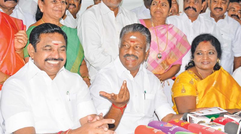 Chief Minister Edappadi K. Palaniswami and his deputy O. Panneerselvam release a list of constituencies allotted to the allies in Chennai on Sunday. Also seen is BJP state president Tamilisai Soundararajan.  (DC)