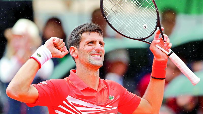 Djokovic tops ATP rankings; beats Nadal, Federer
