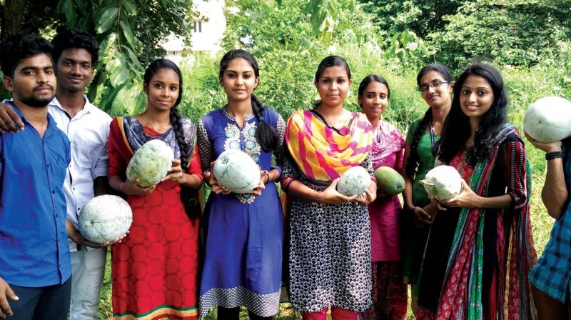 Students of Sri C. Achutha Menon Government College with the produce