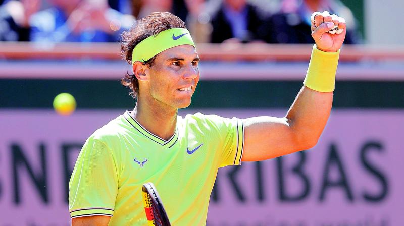 Rafael Nadal reacts after beating Roger Federer in the mens singles  semifinal at the French Open in Paris on Friday. 	 AP