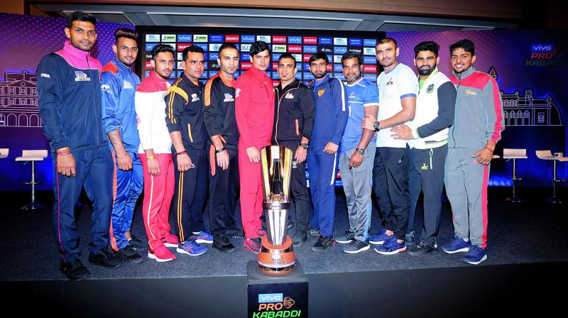 Captains pose with the Pro Kabaddi League trophy in Hyderabad on Friday, ahead of the season opener.