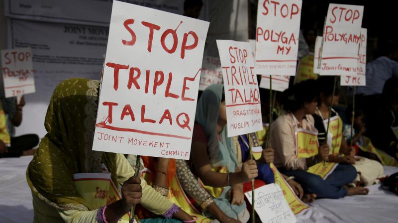 Activists of various social organisations hold placards during a protest against \Triple Talaq\, a divorce practice prevalent among Muslims in New Delhi, India, Wednesday. (Photo: PTI)