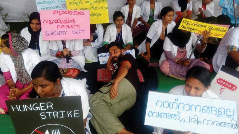 Students on indefinite hunger strike in front of the OP block of the Govt Medical College in Manjeri. (Photo: DC)