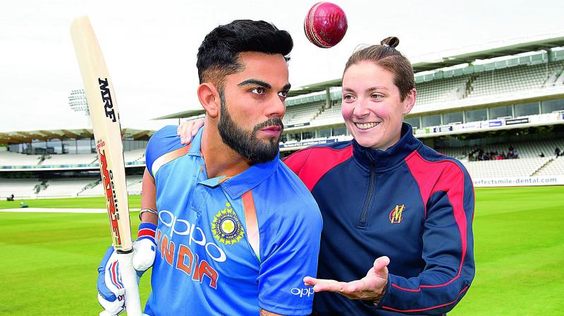 A member of the staff gets up close to Madame Tussauds Londons newly unveiled figure of Virat Kohli at Lords Cricket Ground. The figure will be available for guests to see at the world-famous attraction from Thursday.